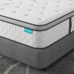 an image of a mattress that is on the floor in front of a carpeted area