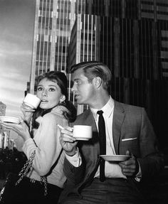 black and white photograph of man and woman drinking coffee