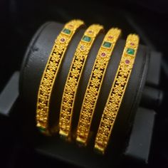 "* Handcrafted Gold Plated 2 Bangle Set. Sold as a set. * Bangles with high quality CZ stones. * High Quality 22K Gold Plated. Bangles Sizes : 2.4 inches= ( 2.25\" diameter of the inner circle) ; 2.6 inches = ( 2.39\" diameter of the inner circle); 2.8inches = (2.50\" diameter of the inner circle) The gorgeous gold-plated bangles set best exemplifies the careful craftsmanship done on it -- specially picked for you by Nemali Jewelry. It has a special tone of elegance attached to it. The intricate Gold Jeweled Bangle For Festivals, Traditional Gold Stackable Bangle, Traditional Gold Jeweled Bracelets, Gold Hand Set Bangle For Marriage, Wedding Bangles, The Inner Circle, Kundan Bangles, Glass Bangles, Bangles Set