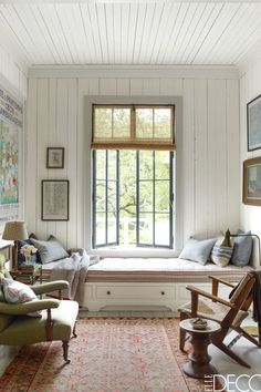 a room with white walls and wood floors