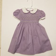 Adorable Purple Dress With Collar, Belt Ties In Back. 3 Buttons. Brand New With Tag. *Has A Small Pull In Front Bottom* Fitted Purple Dress For Dress-up, Purple Fitted Dress With Smocked Bodice, Fitted Purple Dress With Smocked Bodice, Fitted Purple Dresses With Smocked Bodice, Cute Fitted Purple Dress, Cute Fitted Purple Dresses, Purple Short Sleeve Dress For Dress-up Events, Purple Short Sleeve Dress Up Dresses, Cute Purple Short Sleeve Dress