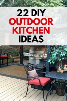 an outdoor kitchen with red chairs and grill on the back deck, surrounded by trees