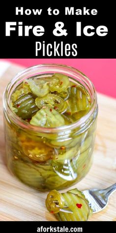 a jar filled with pickles sitting on top of a wooden table