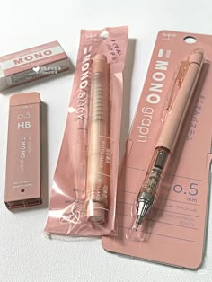 two pens, one pink and the other brown