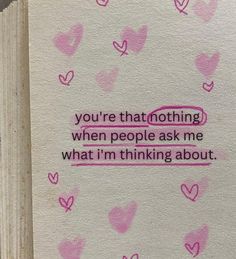 an open book with pink hearts on it and the words you're that nothing when people ask me what i'm thinking about