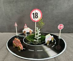 there is a plate that has cars on it and signs in the shape of trees