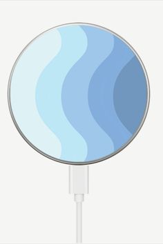 an image of a blue and white circular object on a charger plugged in