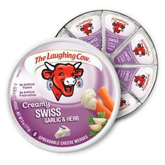 the laughing cow creamy spicy pepper jack is on display in a tin with other toppings