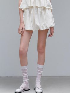 This is a minimal and feminine skirt by ourcomos that is made out of high quality and sturdy material. With distinctive mood of the design and comfortable wear, you can use it for your daily lifestyle.- Light and crispy touch of fabric- Lining with high elasticity- Modern and minimal mood Pleated Hem Short Bottoms For Day Out, High-waisted White Gathered Bottoms, Short Pleated Hem Bottoms For Day Out, Short Length Bottoms With Pleated Hem For Day Out, Short Length Pleated Hem Bottoms For Day Out, Feminine Solid Color Skirt, Cotton Mini Length Gathered Skirt, Cotton Flowy Short Skirt, Stretch Pleated Skirt Bottoms For Daywear