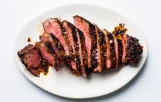 steak sliced up on a cutting board ready to be eaten