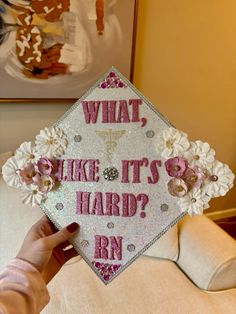 someone is holding up a graduation cap that says, what like it's hard?