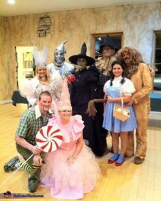 a group of people in costumes posing for a photo