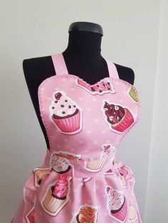 a pink apron with cupcakes on it