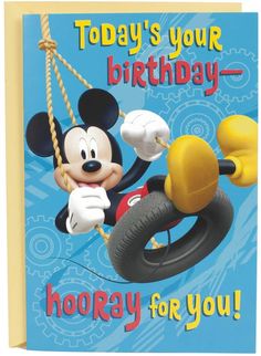 a birthday card featuring mickey mouse on a swing