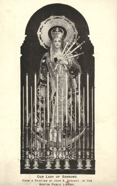 an old black and white photo of a statue with candles in it's hands