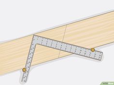 a wooden ruler is shown on top of a piece of wood