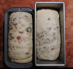 two loafs of bread sitting in a metal pan