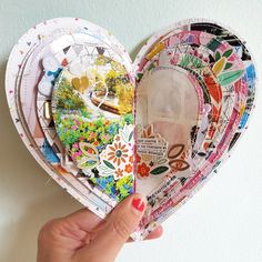 a heart shaped paper plate is held up by a woman's hand with her fingers