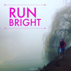 a man is walking along the edge of a river with trees in the background and pink text reading run bright