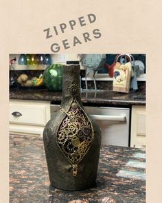 a black vase sitting on top of a counter