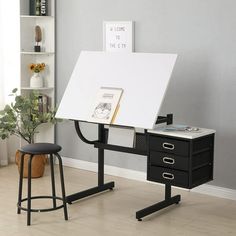 a desk with a white board on it and two stools in front of it