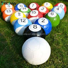 a bunch of balls sitting in the grass with numbers on them and one is missing