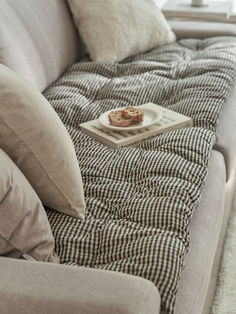 a couch with some food on top of it