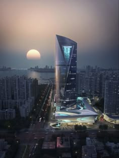 an aerial view of a large building in the middle of a city at night time