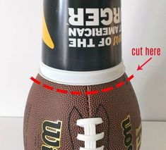 a close up of a football on a table with an arrow pointing to the ball