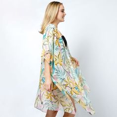 Size : One Size (35" L) Material : 100% Polyester White Poncho For Spring Beach Cover-up, Oversized Chic Outerwear For Beach, Chic Oversized Outerwear For The Beach, Chic Summer Outerwear With Kimono Sleeves, Chic Printed Summer Outerwear, Long Summer Outerwear With Floral Print, Spring Casual Shawl Kimono, Long Floral Print Summer Outerwear, Beige Wrap Cover-up For Spring