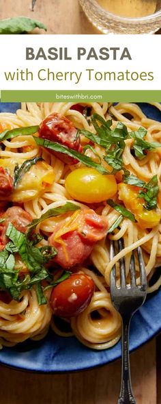 pasta with cherry tomatoes and basil on a blue plate