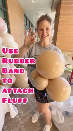 a woman standing in front of balloons with the words use rubber band to attach fluff