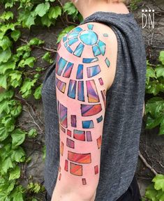 a man with a colorful tattoo on his arm