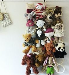 there are many stuffed animals hanging on the wall