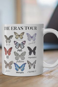 a white coffee mug with butterflies on it