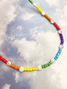 a colorful beaded necklace with smiley faces on it