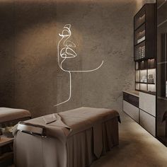 a spa room with a large stone wall and white lines on the wall above it