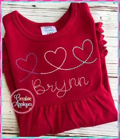 a red shirt with hearts on it and the words beryln