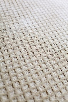 a close up view of a white blanket