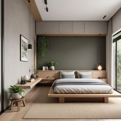 a large bed sitting next to a window on top of a wooden floor covered in pillows