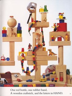 a wooden toy tree with lots of toys on it's sides and an article about how to use them