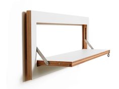 a white shelf with a wooden frame on it