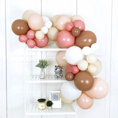 the balloon wall is decorated with balloons and other things to put on it's shelves