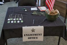 a table with an entertainment office sign and american flag in the background, on carpeted room floor