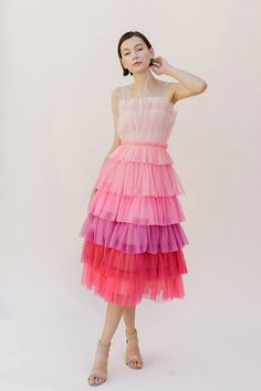 This pink ombre tulle midi dress is perfect for that special occasion. Its multi-color design, combined with the elegant design of the spaghetti straps and back zipper, give this flirty midi dress a unique look and feel. With its flattering silhouette and great style, this dress is the perfect way to make a statement. Ombre Tulle Dress, Tulle Midi Dress, Modest Tops, Ombre Dress, Tiered Midi Dress, Pink Tulle, Layer Dress, Fuchsia Color, Tulle Fabric