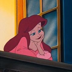 ariel from the little mermaid looking out an open window with her hand on her chin