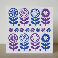 a card with blue and purple flowers on it