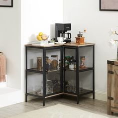 a kitchen area with a microwave, coffee maker and other items