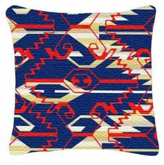 a blue and red pillow with an abstract design