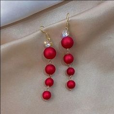 Beautiful Gold Tone Vibrant Bright Red Christmas Ball Colored 4 Balls Dangled Earrings With Clear Gems. About 1.5-2" Drop. New Never Worn. Follow Me For Updates And New Listings, Please Share, And Check Out My Other Items While You're Here. Thanks So Much. Comes From A Clean Smoke, Pet, Co Vid, And Bug-Free Home. Thanks Again. Buy Or Make Me An Offer I Can't Keep Up With The Bidding Wars And Politics Of These Sites. Bizzy Bee Breezy's Boutique With Every Purchase Bracelets Diamond, Long Pearl Earrings, Red Pearl, Knot Stud Earrings, Knot Studs, Beach Birthday, Long Tassel Earrings, Jewels Rings, Jewellery Necklace